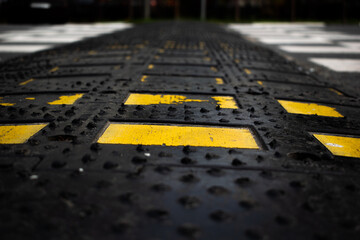 Black rubber with yellow accents and road background