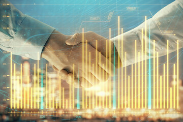 Double exposure of financial chart on cityscape background with two businessmen handshake. Concept of financial analysis and investment opportunities