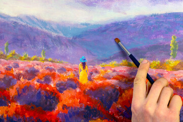 Artist hand with a brush closeup paints a beautiful picture paintntg artwork on canvas