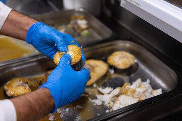 Cooking cod with care in the kitchen.