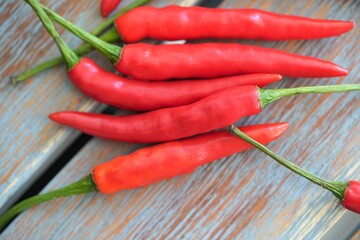 red chili peppers on vintage wooden table