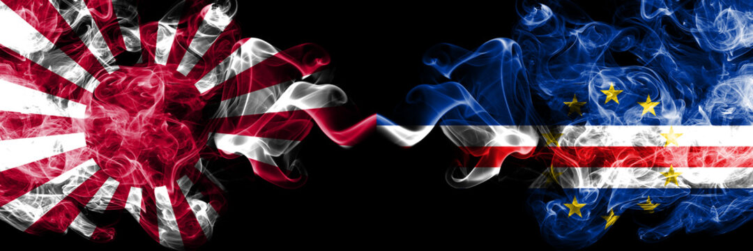 Japan rising sun naval vs Cape Verde smoky mystic flags placed side by side. Thick colored silky travel abstract smokes banners
