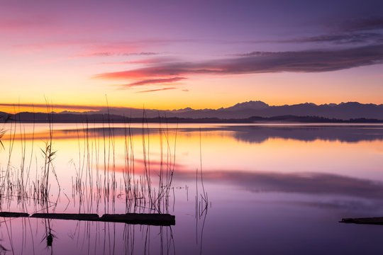 Monte Rosa reflecting on Lake Varese during a winter sunset at Calcinate del Pesce, Varese Province, Lombardy, Italy.