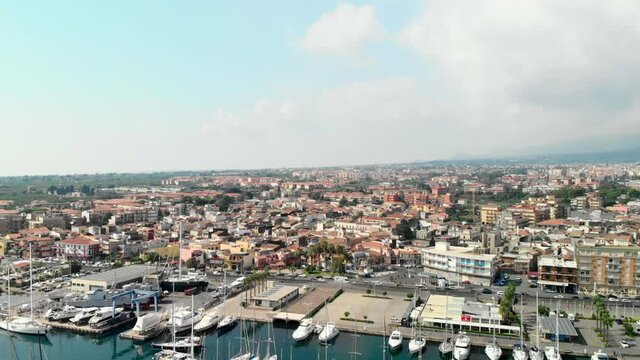 Aerial of Giarre town and marina di riposto in sicily, italy