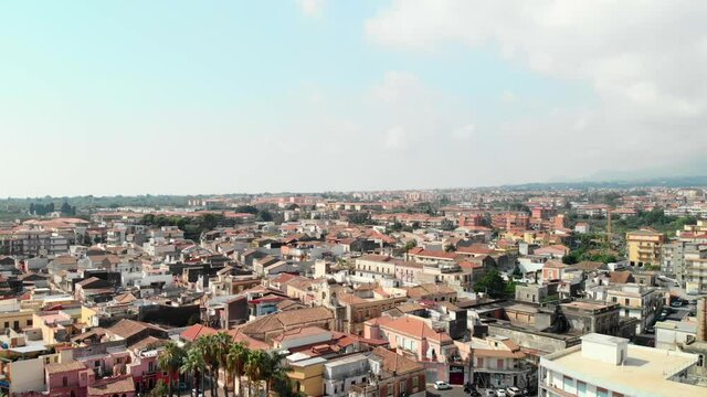 View of Sicily town Giarre in Italy, aerial ascend