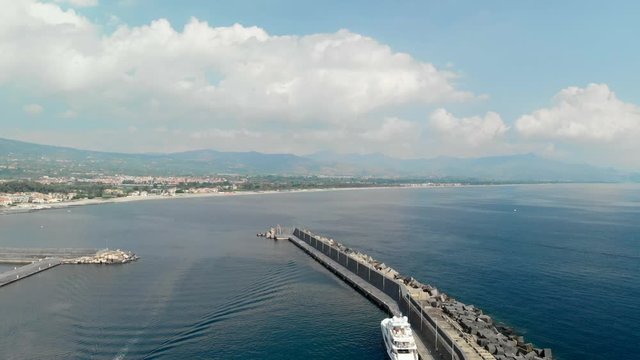Aerial along Marina di RIposto harbour in Sicily Italy