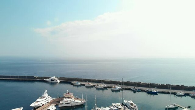 Aerial above yachts in marina di riposto harbour, Sicily Italy