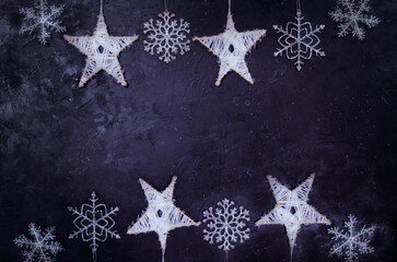 Hand made snowflakes on black shabby background