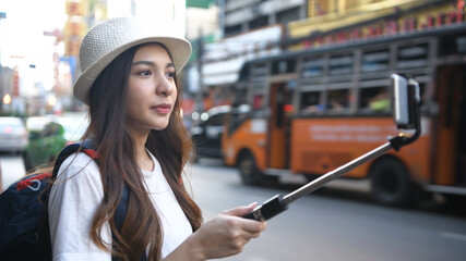 Travel concept. Beautiful girls are broadcasting live tourism in the city. 4k Resolution.