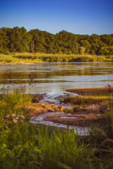Beautiful view with a small source on the Odra River with a beautiful summer blurred background.;