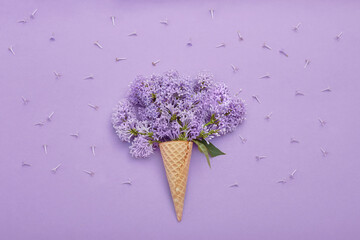 Top view of laying lilac flowers lying on the table, spring has come, copy space purple background. Lilac blossom, spring cosmetics for face and hands