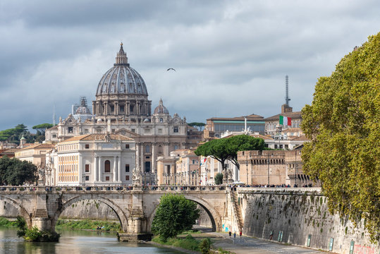The view on Tiber River with bridge Sant'Angelo and Basilica di San Pietro in the background Rome Lazio Italy Europe