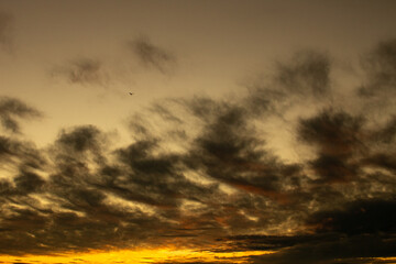 Beautiful and romantic sunset on the sea coast. Deserted beach paradise. Fall of the sun.