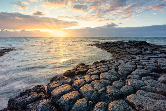 a magical sunrise whit basaltic stone, Trou d'Eau Douce, Mauritius, Indian Ocean, Africa