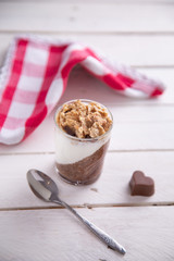 Delicious breakfast, cocoa chia pudding with yogurt and cereals