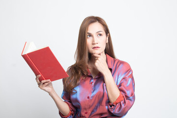 Young Asian woman with a book is thinking.