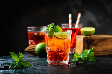 Red fresh cocktail with ice and lime