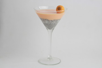 glass with chia and medlars pudding