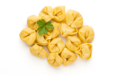 Raw homemade pasta,tortellini with herbs.