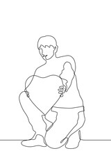 continuous one line drawing the young man squats and holds out a large flat heart to the viewer with outstretched arms. It can be used for animation. Vector