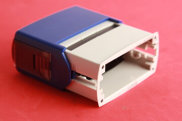 Automatic ink stamp manufactured in blue plastic