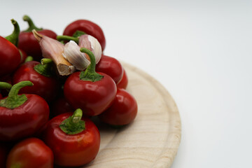 Side view of ripe red hot chili peppers, spices and fiery emotions. Mix of garlic and red peppers