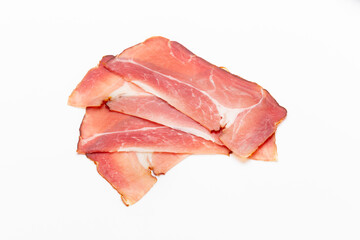 Hamon sliced on white background. Spanisch traditional meat.