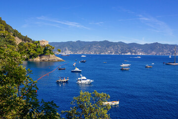 Obraz premium The beach near portofino in genoa on a blue sky and sea background