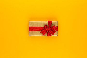 Christmas, holiday present box on red background.
