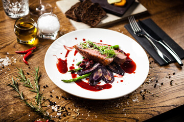 Duck breast served on a plate in restaurant