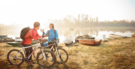 Panoramic photo of a beautiful happy young couple enjoying their break from an early morning...