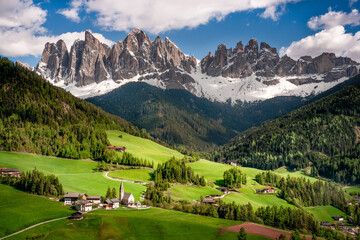 Fototapeta na wymiar The Valley Val di Funes in Italy . Santa Maddalena church, on background the Odle group mountains.