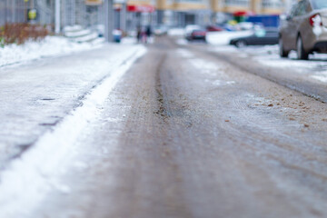 traces of tyre tracks in the snow in a thaw,taken in early November