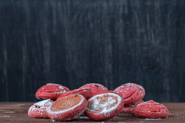 pink cookies on a dark background