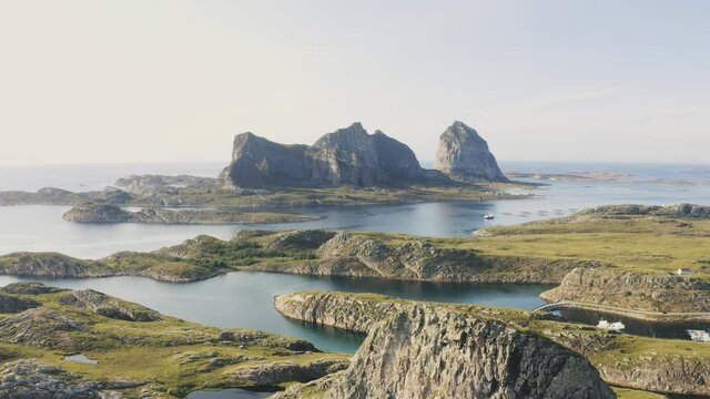 Aerial view above Traena islands in Norway man running on rocky mountain travel destinations amazing nature landscape 