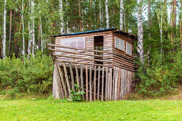 wooden house made with his own hands near the forest