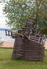 installing a decorative windmill made of wooden sticks. DIY