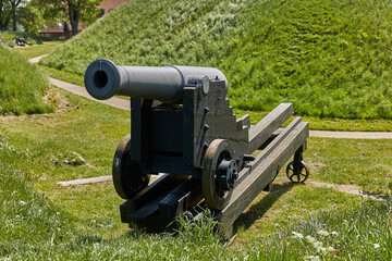 Old bronze cannon on rampart in city Fredericia, Denmark