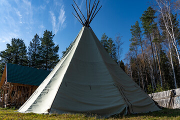Native American wigwam in the forest. Modern material for the manufacture of wigwam. Yurt is the home of the northern peoples. © woff