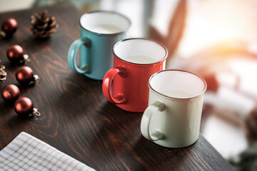 ot drink in cup on wooden table and blurred background of window. Free space for your decoration and small plants. Home interior and copy space. 