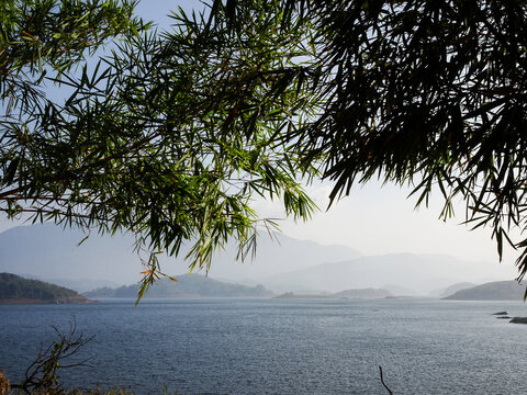 a reservoir with mountains in the background