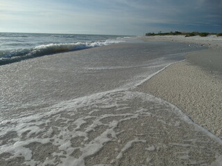 closeup of deserted florida sandy shoreline on sanibel island #3