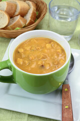 bowl of soup with vegetables and croutons