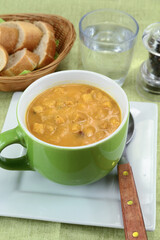 bowl of soup with vegetables and croutons