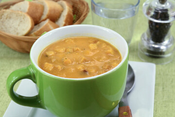 bowl of soup with vegetables and croutons