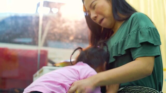 Happy loving family. Mother and her daughter child girl playing high five and hugging
