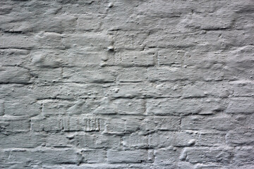 white brick wall covered with putty