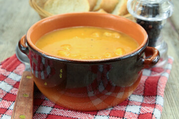 bowl of soup with vegetables and croutons