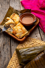 Mexican tamales wrapped in banana leaves also called 