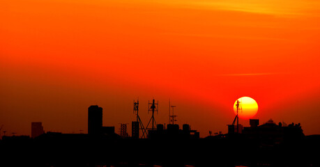 Sunset view Beautiful golden yellow sky in big cities